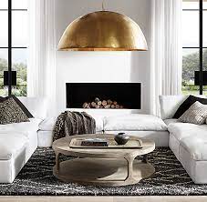 Crafted of solid pine wood, this coffee table strikes a rectangular silhouette featuring plank panel construction, recessed paneling, blackened hardware, and four chunky legs. Martens Round Coffee Table