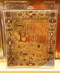 The base of this product is a decorative book box. Disney Parks Walt Disney Archives Sleeping Beauty Replica Storybook Notecards