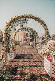 Bride and groom embracing in the forest. 18 Fascinating Ideas For Your Wedding Entrance Walkway Decor