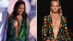 The sheer fabric was printed with a tropical leaf and bamboo pattern, and cut with a very low neckline that extended well past lopez's navel, while the waist of the dress was studded with citrines. Jennifer Lopez S Iconic Grammy Dress Gets New Life On Versace Runway