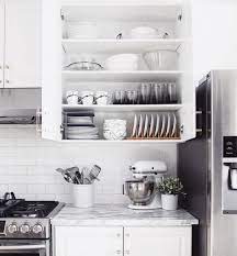 Are Your Konmari Senses Tingling These Organized Kitchen Cabinets Are A Wonder To Behold Kitchen Set Cabinet Small Kitchen Organization Kitchen Cabinet Organization