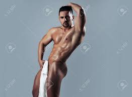 Handsome Naked Muscular Sexy With Towel. Sexy Man Holds White Sheet On Grey  Background. Nude Man Or Gay With Muscle Torso, Naked Male Body. Фотография,  картинки, изображения и сток-фотография без роялти. Image