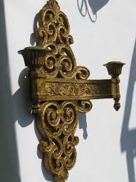 Shown in black rust and amber mica. Spanish Colonial Gothic Style Pair Of Vintage Gold Syroco Wall Sconces