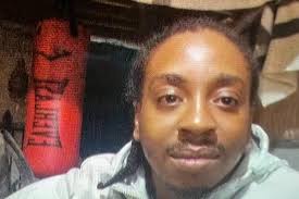 Killer who stabbed man to death and dressed as a woman to evade police  jailed