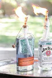 How To Make Your Own Diy Whiskey Bottle Tiki Torch Diy Outdoor Bar Diy Whiskey Bottle Crafts
