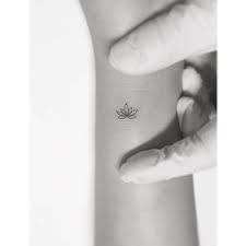 This design is ideal for anyone looking for a simple lotus flower tattoo on the wrist. Tiny Minimalist Lotus Tattoo On The Wrist