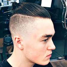 Men S Top Knot Hairstyle Undercut With Top Knot Mens Hairstyles Short Undercut Hairstyles Mens Hairstyles Undercut