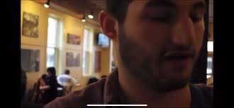 Guy Singing Get Low in A Coffee Club