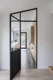 minimalist long narrow paris kitchen with indoor outdoor dining areas by philippe harden minimalist dining room home minimalist home