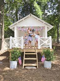 A 2 story playhouse plan with a large sand box area below, and a wooden playhouse with a wrap around porch above. 22 Kids Playhouse Ideas Outdoor Playhouse Plans