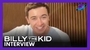 Tom Blyth Talks Finding The Root Of Complicated Characters Like Billy The  Kid and Coriolanus Snow