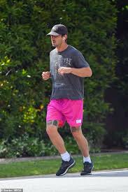 The american honey actor grinned as he lifted up his shirt to show some pretty impressive abs, and an even more impressive tattoo covering. Shia Labeouf Shows Off His Tattoos As He Goes For A Jog In Bright Pink Shorts Daily Mail Online