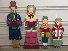 These classic christmas blow mold lighted carolers are a must for your outdoor decor. Christmas Carolers Life Size Family Set Of 4 Outdoor Wood Yard Etsy Wood Yard Art Wooden Christmas Decorations Christmas Yard Art