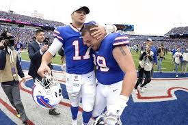 Buffalo Bills Quarterback Josh Allen 17 And Defensive Tackle Harrison Phillips 99 Celebrate A Buffalo Bills Quarterbacks Buffalo Bills Nfl Football Players