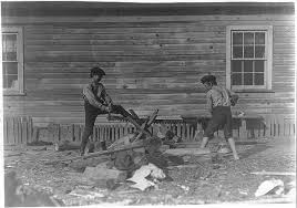 Boys working in Maple Mill, Dillon, S.C. Pete Dunlap (smaller). Said 11  years old. Mannings Dunlap. Both doff--40 cents a day. Location: Dillon,  South Carolina.