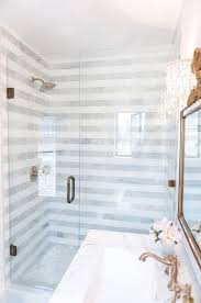 Beautiful Bath Room Love The Gold Faucet Striped Tile Pattern And Glass Shower Door Masterbathrooms Bathroom Top Bathrooms Remodel Home