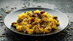 In this recipe, you cook the rice with lemon zest for a bright flavor, and then decorate with roasted chopped almonds and apricots that soften just enough. Morrocan Style Fruit Couscous Salad With Raisins Dried Apricots And Pumpkin Seeds On Dark Background Stock Photo Picture And Royalty Free Image Image 140555339