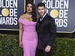 This december, the star made her virtual debut as the british fashion council's new ambassador for positive change in a white pantsuit with. Golden Globes 2020 Priyanka Chopra And Nick Jonas Look Like Hollywood Royalty As They Take Over The Red Carpet Hindi Movie News Times Of India