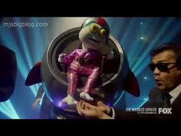 Her spacesuit is red with accents of magenta. The Masked Singer Season 4 Meet Baby Alien Youtube