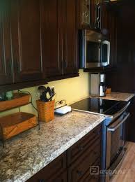 White Galaxy Granite With Dark Cabinets Installing Granite Countertops Kitchen Remodel Kitchen Dining