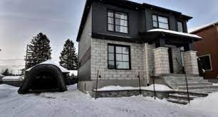 Revêtement «canexel», fait en fibres de bois. Canexel Granite Siding Cabin Exterior House Exterior Exterior