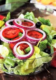 Making A Bowl Of Copycat Olive Garden Salad Image In 2020 Olive Garden Salad Dressing Yummy Salad Recipes Olive Garden Salad Dressing Recipe