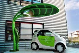 Leaf Shaped Lotus Electric Vehicle Charger Doubles As A Solar Powered Led Streetlight Electric Cars Electric Car Charger Electric Car Charging