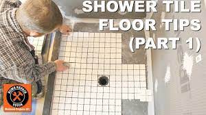 Lay the tarpaper flat on the floor and, using a level and utility knife, cut the tarpaper to the necessary size. How To Tile A Shower Floor Part 1 Layout For 2x2 Tiles Youtube