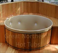 Our cedar hot tubs are the ultimate relaxation experience matched with the elegance of canadian handcrafted cedar. Cedar Hot Tub With Flush Deck Showing Customizable Jets