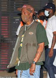 Travis scott dressed as batman for halloween. Travis Scott Rocks An Olive Green Vest And Light Wash Baggy Jeans As Leaves Nobu Malibu With Friends Readsector