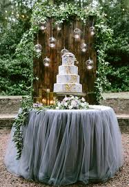 You can use flowers that you've already used in the wedding ceremony, or you can use flowers specifically for the wedding cake table. Turn Wedding Cakes Into Fabulous Flower Cake Tables