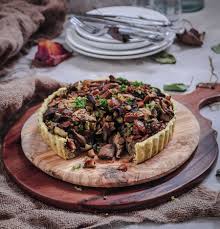 A mushroom, chestnut and ale mixture topped with some shortcrust pastry. Chestnut Mushroom Caramelised Onion Tart Vegan Food Living