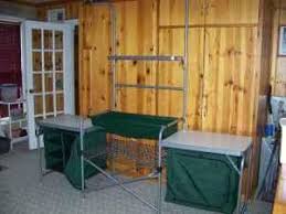 This kitchen collapses from 63 x 17 x 64 to 34 x 7.5 x 20 in seconds, making it extremely portable. Cabelas Camp Kitchen Kitchen