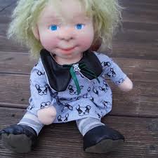 12-inch doll with painted shoes and yarn hair