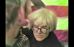 Andy Warhol autographs his book "America" at Fiorucci