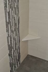 Vertical Glass Tile Waterfall Feature With Shaving Ledge Bathrooms Remodel Remodel Rustic Storage