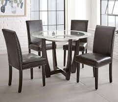 Set it up in the kitchen to enjoy casual breakfasts and lunches in style, then stock up the three storage shelves with plates and serveware to set the table at a moment's notice. Steve Silver Verano 5pc Contemporary 45 Round Glass Top Dining Table Set With Black Chairs Standard Furniture Dining 5 Piece Sets