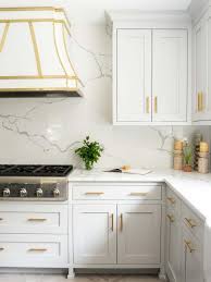 All kitchen cabinets are of antiqued white finish with molding details and topped with a gorgeous slab of beige granite. 100 Gorgeous Kitchen Backsplash Ideas Unique Backsplashes For The Kitchen Hgtv