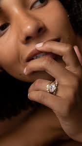 Forever elegant — The Viola Ring features a striking trio of step cut  gemstones. An emerald cut centre, with two perfectly proportioned baguette  cuts either side. Stacked with The Emerald Harper Bezel