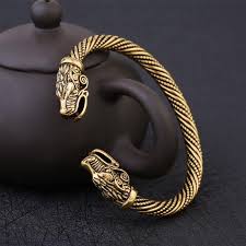 A torc, also spelled torq or torque, is a large rigid or stiff neck ring in metal, made either as a single piece or from strands twisted together. Wolf S Head Torc Bracelet Antique Gold Plated