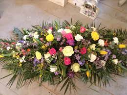 Please call for the price for the larger sizes this funeral casket spray was made in our local aberdeen flower shop Funeral Flowers Bright And Colourful Spring Coffin Spray Casket Funeral Tribute Www Thefloralarts Funeral Flowers Funeral Flower Arrangements Funeral Floral