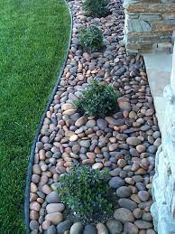 River rock does not pack and so is consider how the rock will be used. Black Star Gravel Landscape Black Granite Landscape Gravel Star Small Front Yard Landscaping Landscaping With Rocks Rock Garden Landscaping