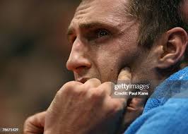 Referee Peter Houghton steps in to seperate Sean Lampley of the... News  Photo