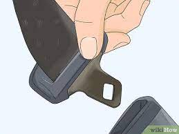 The seat belt can be released by inserting a key or small object into the small hole. How To Open A Seat Belt Buckle Cover 12 Steps Wikihow