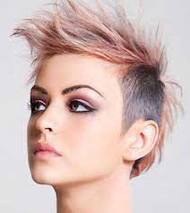 From the style and color of those baby emo bangs to the long sides and that bitchin' crossbones, this is one of our favorite short punk hairstyles. Best Short Punk Haircuts