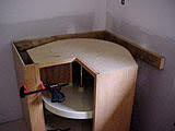 Installing 170 degree opening hinge (doors to cabinet) we bored holes in the door that is attached to the mounting plate of the pie cut hinge. Corner Sink Installation In Corner Lazy Susan Cabinets Home Improvement Stack Exchange