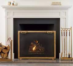 This fireplace screen features three hinged panels with beautiful scrolled two tone wrought iron. Industrial Fireplace Screen Pottery Barn
