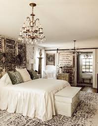 All white bedroom goals with ornate wall art and vintage white provincial canopy bed. Decorating With Vintage Items In The Master Bedroom Deb And Danelle
