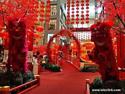 Lovely 2015 Chinese New Year Ideas With Double Cute Lion Featuring Awesome Red Flower Plant And Combine Red Color Rug Of Attractive Chinese New Year Decor For S
