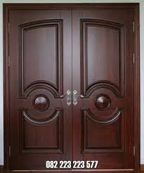 Material bahan kayu jati tua sehingga kami berani menggarasi pintu rumah dari toko mebel jati kami awet dan anti lengkung meski terkena sinar matahari dan hujan. Pintu Jati Minimalis Kupu Tarung Model Polos